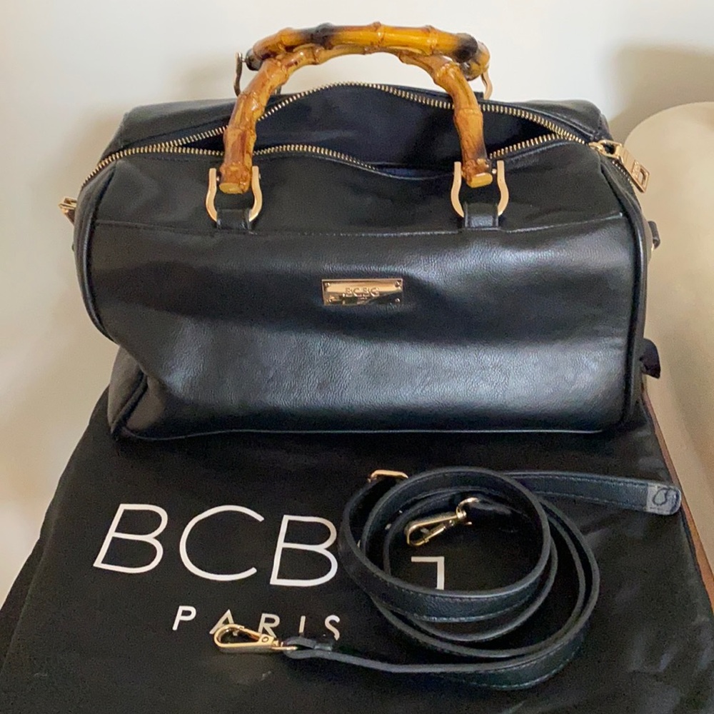 Leather bag by BCBG with adjustable long strap and dust cover